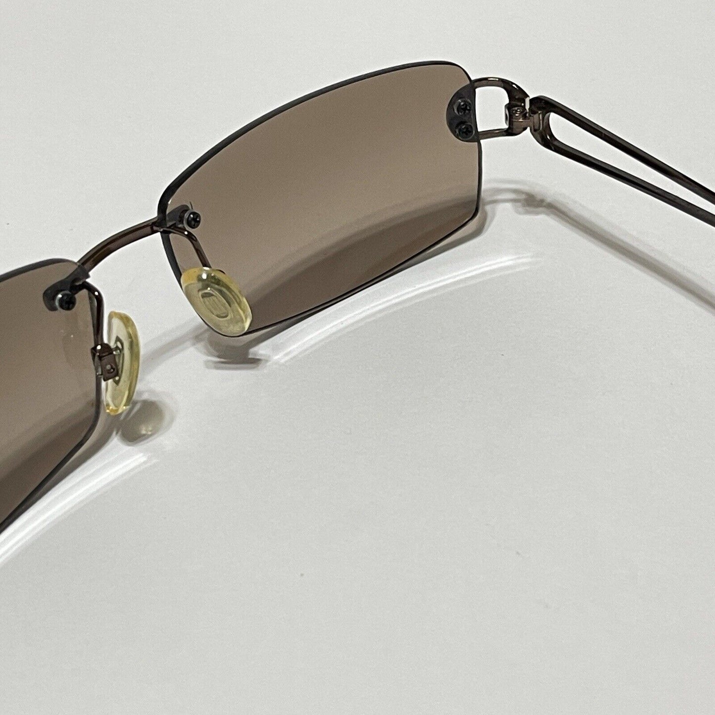 Nine & Co Rimless Sunglasses Bronze Metal Brown Lenses Rectangle