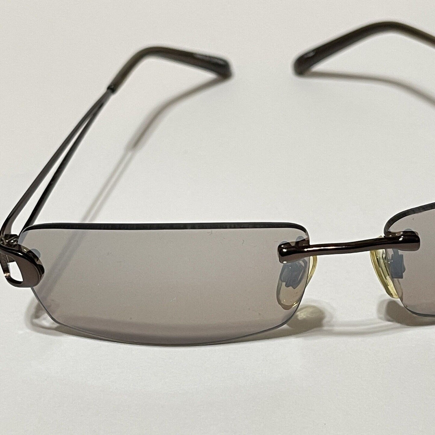 Nine & Co Rimless Sunglasses Bronze Metal Brown Lenses Rectangle